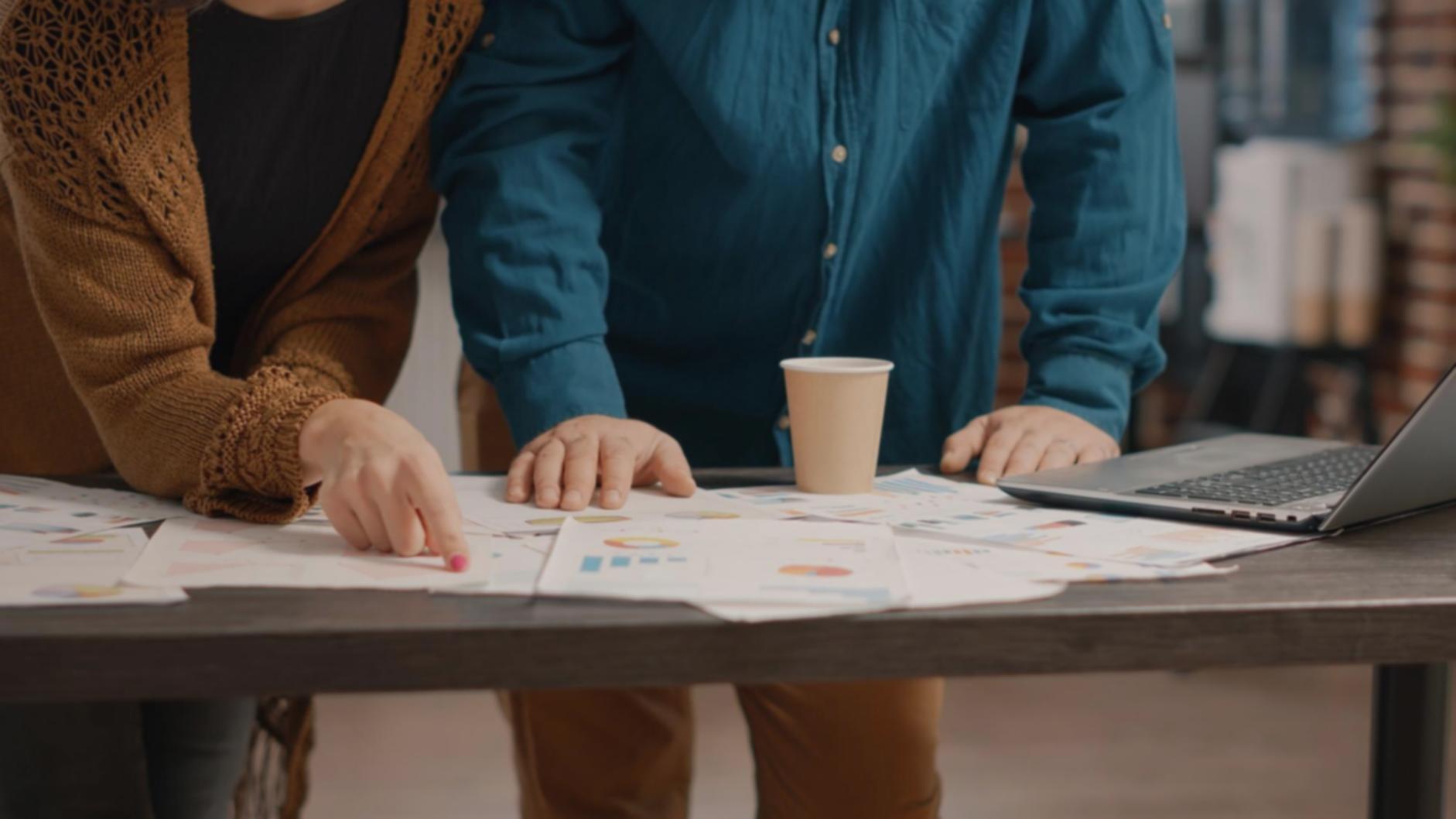 Family discussing financial planning around kitchen table